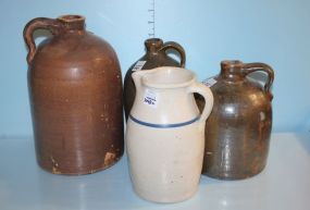 Three Pottery Jugs along with a White Pottery Pitcher