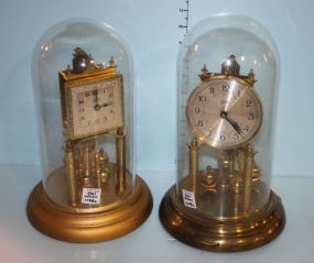 Two Brass Clocks with Glass Domes