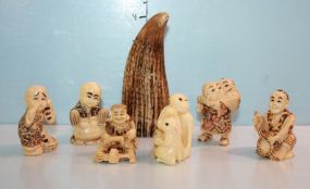 Group of Six Netsukes and a Reproduction Schrimshaw with Carving
