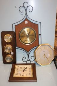 Three Hanging Battery Operated Wall Clocks and a Hanging Barometer