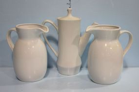 Pair of White Pitchers along with Pitcher with Lid