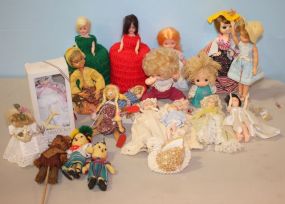 Four Porcelain Face Baby Dolls along with Large Group of Other Dolls