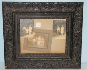 Black Carved Frame with Family Pictures