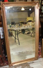 Large Beveled Mirror in Gold Frame with Carving in Each Corner