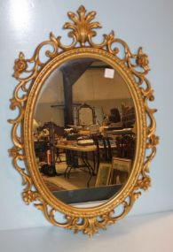Oval Mirror in Plastic Open Carved Gold Frame