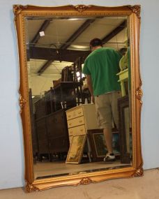 Beveled Mirror in Carved Gold Frame