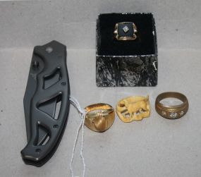 Group of Four Men's Rings and one Gerber Pocket Knife