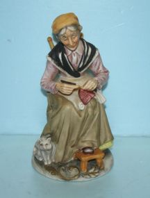 Bisque Figurine of an Elder Lady and Dog