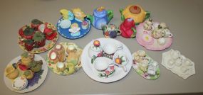 Eight Miniature Tea Sets and Four Small Tea Pots