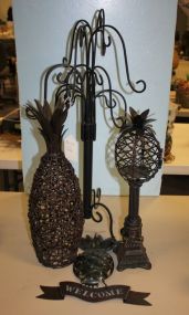 Iron Candleholders and a Metal Welcome Sign