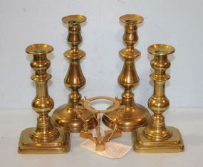 Four Brass Candlesticks and a Brass Stand