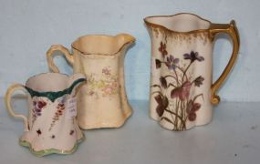 Three Antique Porcelain Hand Painted Pitchers