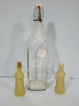 Large Glass Bottle along with Two Small Yellow Bottles