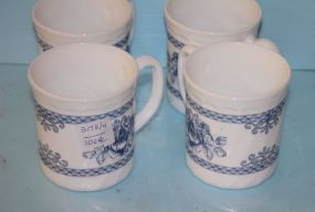 Set of Four Blue and White Painted Mugs