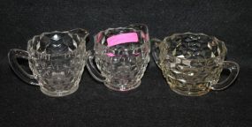Two Press Glass Pitchers and a Creamer