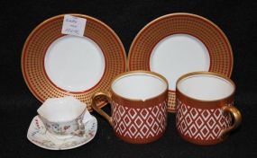 Two Cups and Demitasse Saucers along with one Miniature Cup and Saucer