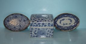 Blue and White Covered Square Box along with Two Blue and White Oval Dishes