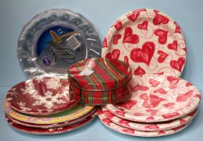 Group of Paper Plates and Small Tin Container