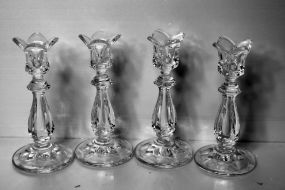 Group of Four Clear Glass Candlesticks