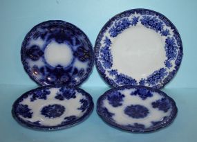 Three Flow Blue Saucers and One Blue and White Saucer