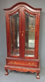 Reproduction Mahogany Chippendale Style Glass Cabinet Has two glass doors, glass sides, three glass shelves, ball and claw feet. 33 1/2