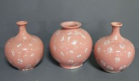 Three Pink Ceramic Vases with Snowflake Design