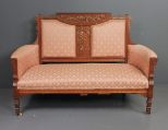 Walnut Eastlake Settee Description