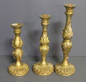 Three Decorative Gold Painted Candlesticks Description