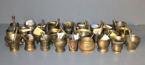 Collection of Twenty Seven Brass Schering Mortar and Pestles Description