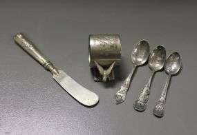 Quadruple Plate Napkin Ring along with a Butter Knife and Three Demitasse Spoons