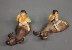 Two Oriental Mud Pottery of Children on Water Buffalo