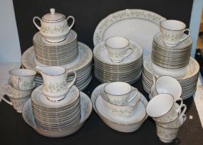 Noritake China Consisting of 12 dinner plates, 12 salad plates, 12 bread/butter plates, 12 cups and saucers, platter, vegetable bowl, creamer, sugar, 12 cereal bowls, 12 berry bowls, gravy boat.