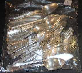 Roders Brother Silverplate Flatware Consisting of 7 Salad Forks, 1 dinner fork, 8 afternoon forks, butter knifes, 13 teaspoons, 8 serving spoons, 8 knives.