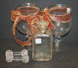Two Large Glass Candleholders, Etched Bottle, 2 Knife Rest Two Large Glass Candleholders, Etched Bottle, 2 Knife Rest.