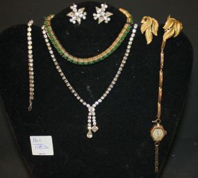 Group of Vintage Jewelry Ciner bracelet, rhinestone necklace, bracelet, earrings, Simmons ladies watch, trifari earrings.