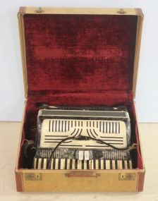 Antique Plamer-Hughes Accordian in case, great condition, plays well.