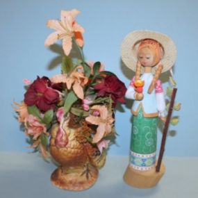 Wood Carved Girl and Floral Arrangement in Ceramic Turkey Vase Description