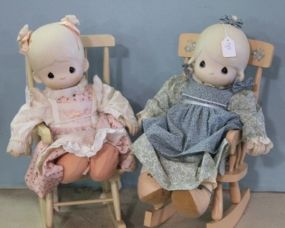 Large Precious Moment Dolls Seated in Rocking Chairs Description