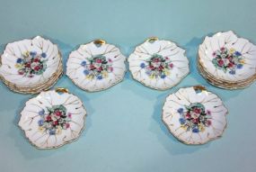 Twelve Butter Pat Saucers with Floral Pattern Description