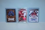 Three Baseball Player Cards In Plastic Cases Description