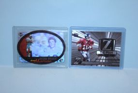 Two Football Player Cards In Plastic Cases Description
