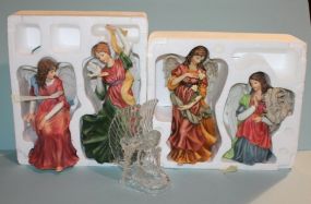 Four Angel Figurines with an Angel Tea Light Description