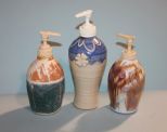 Three Pottery Soap Dispensers Description