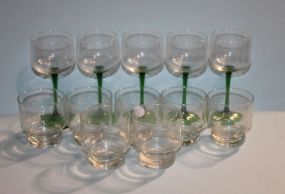 Five Green Stemmed Wine Glasses and Seven Clear Glasses Description