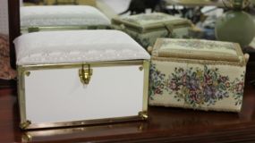 Two Decorative Fabric Covered Cases Description