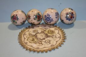 Group of Hand Painted Decorative Balls and Fabric Doily Description