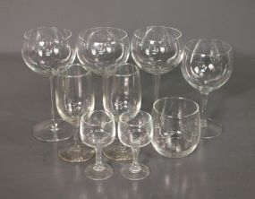 Group of Nine Various Sized Clear Wine and Brandy Glasses Description