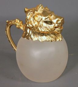 Translucent Pitcher with Gold Colored Lion's Head Lid Description