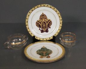 Three Decorative Plates Including Creamer and Sugar with Gold Trim Description