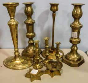 Eleven Various Sized Brass Candlesticks